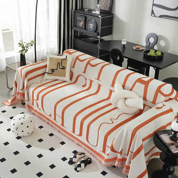 Jeté de canapé orange élégance